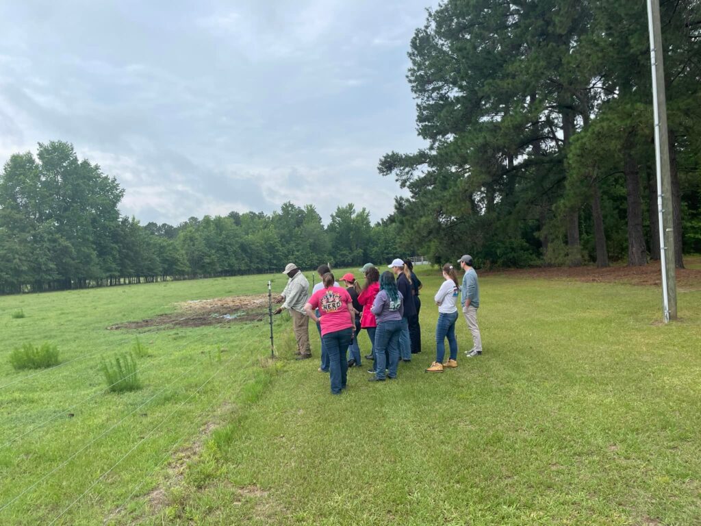 2023 Cohort working on dairy farm