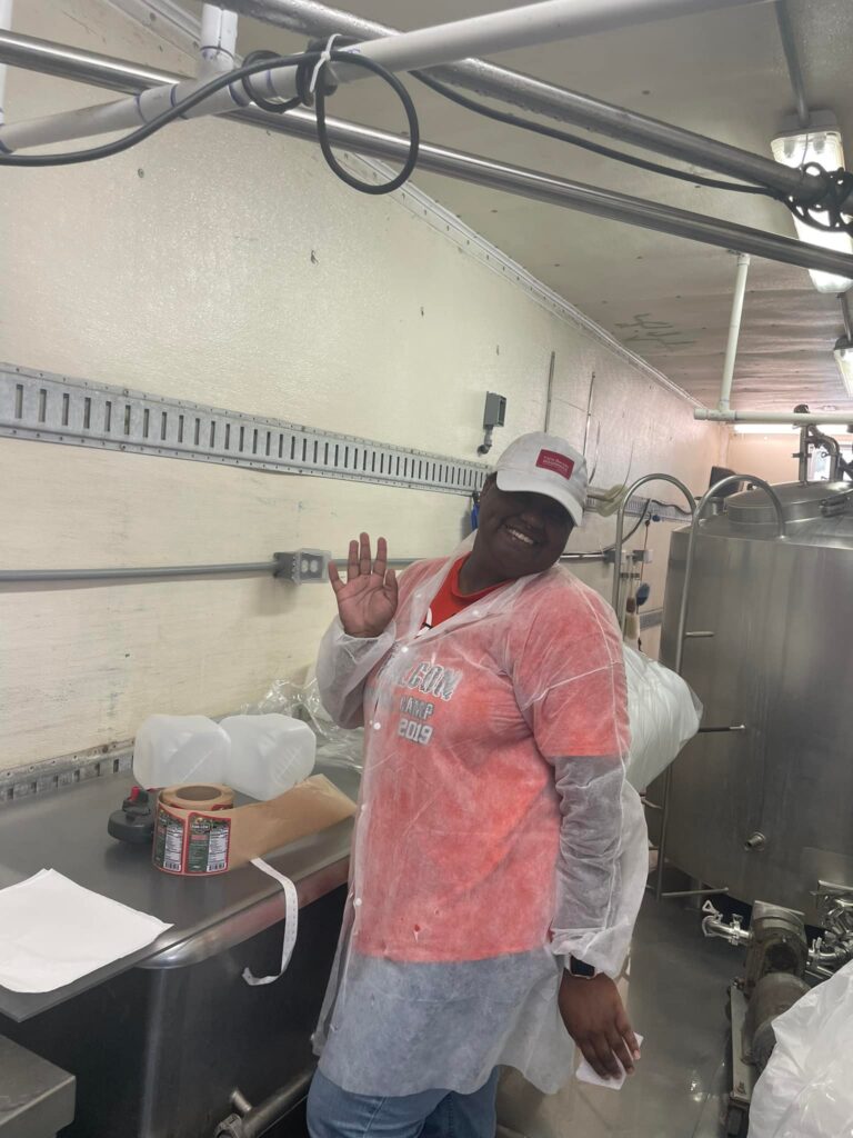 Person in processing area posing for camera
