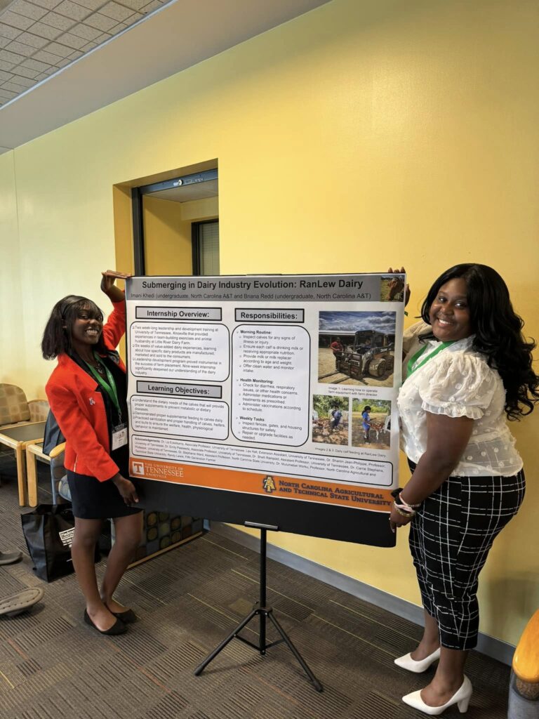 Members of 2024 Cohort standing with poster