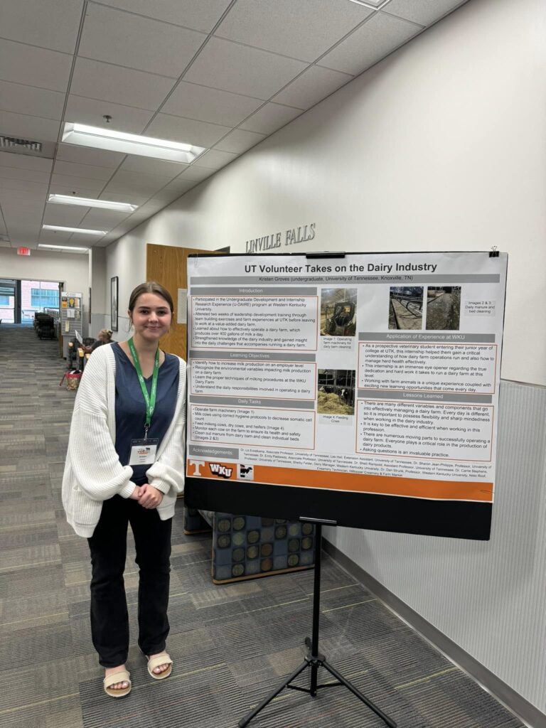 Person standing next to poster
