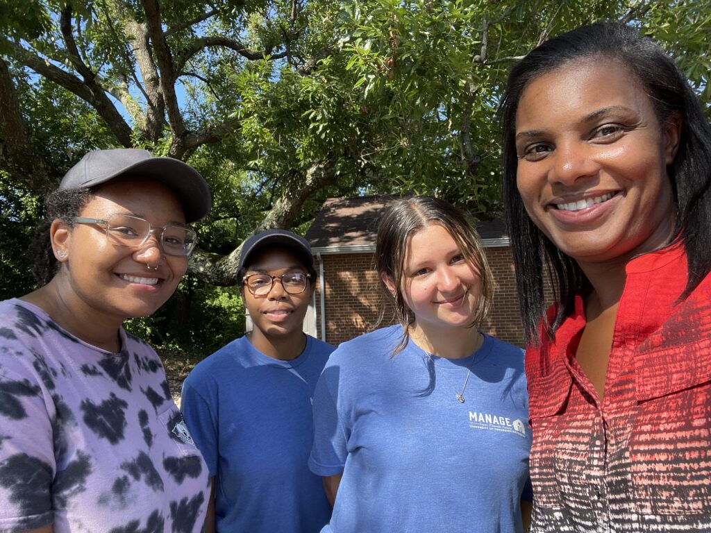 4 people smiling for the camera