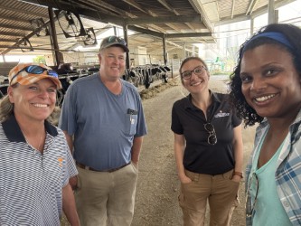 faculty members inside dairy facility