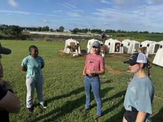 three students in field