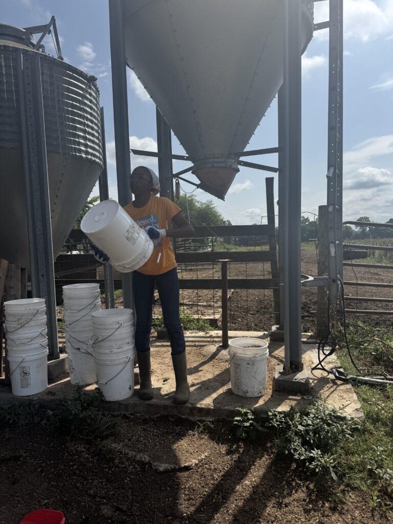 Woman holding a 5-gallon bucket