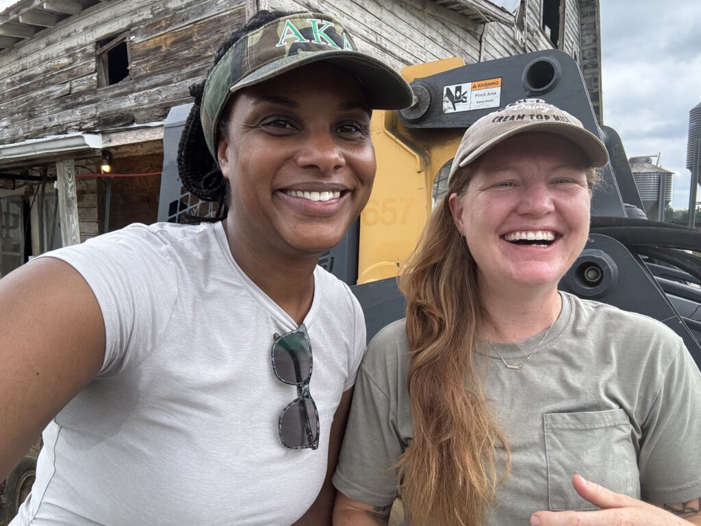 Two women smile and laugh for the camera